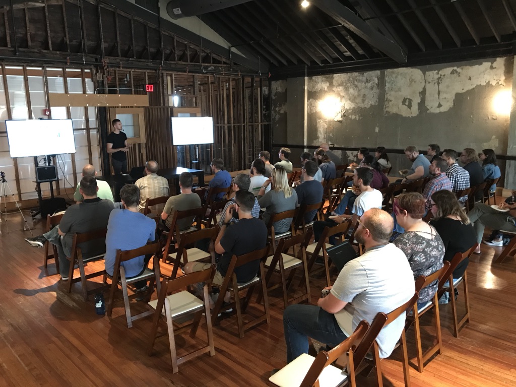 Group of people watching presentation